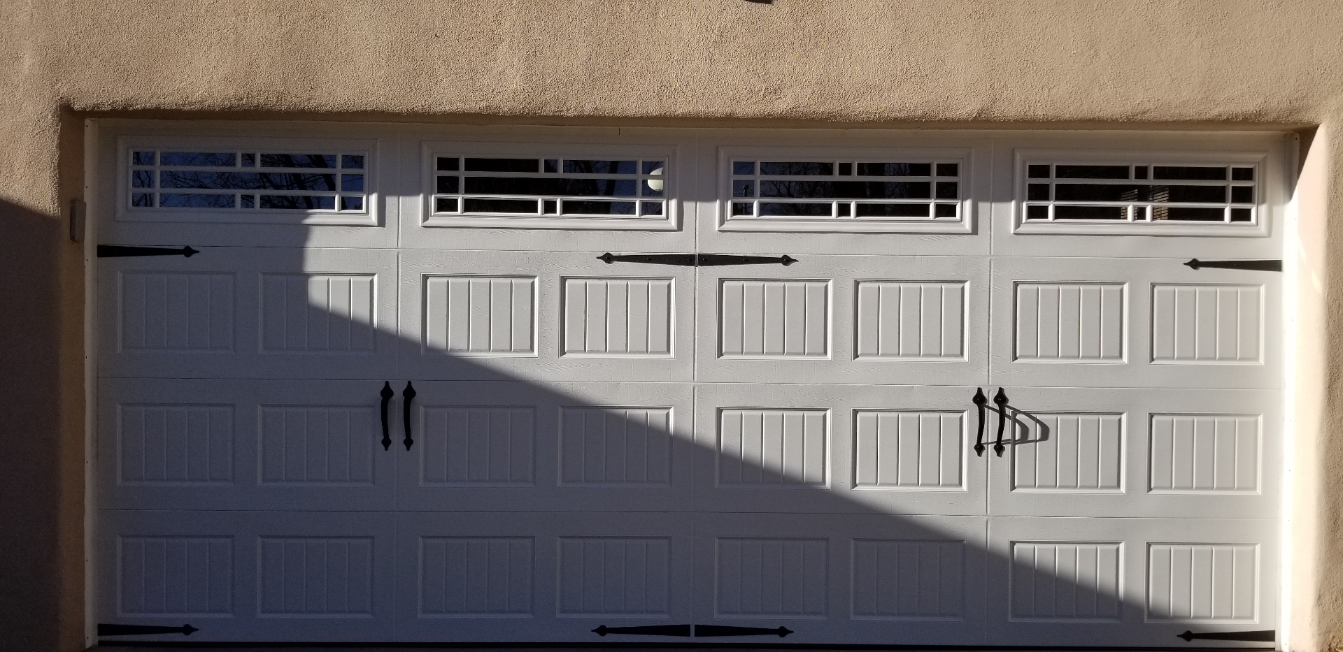 White carriage-style with wrought-iron hardware